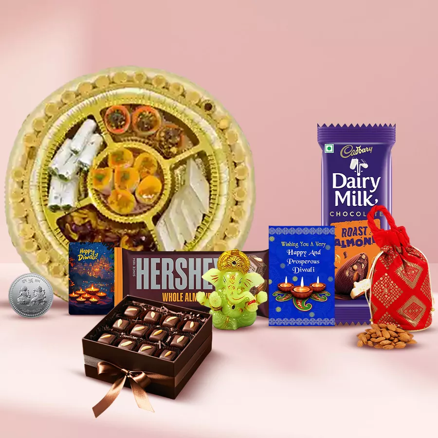 Creativity Overflows Diwali Gift Treat with sweets, chocolates, Ganesh idol, almond potli, handmade fridge magnet, and festive card.