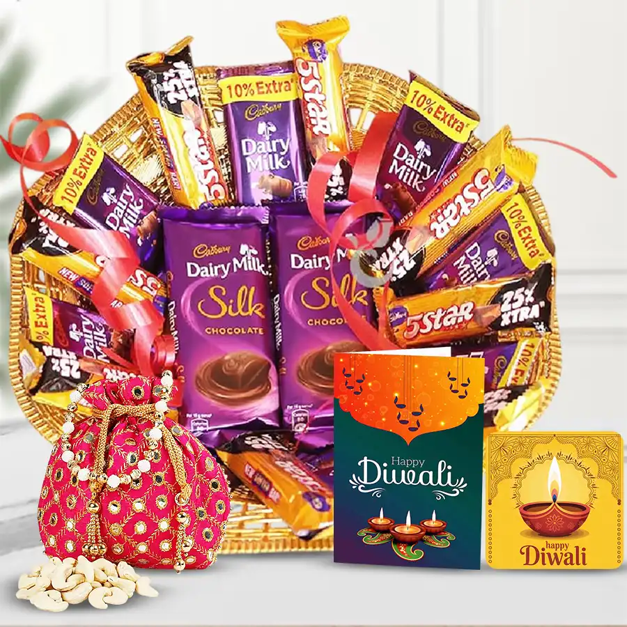 Diwali gift hamper with Cadbury Dairy Milk, 5-Star bars, Silk chocolates, premium cashews, handmade fridge magnet, and a Diwali card in a reusable cane basket.