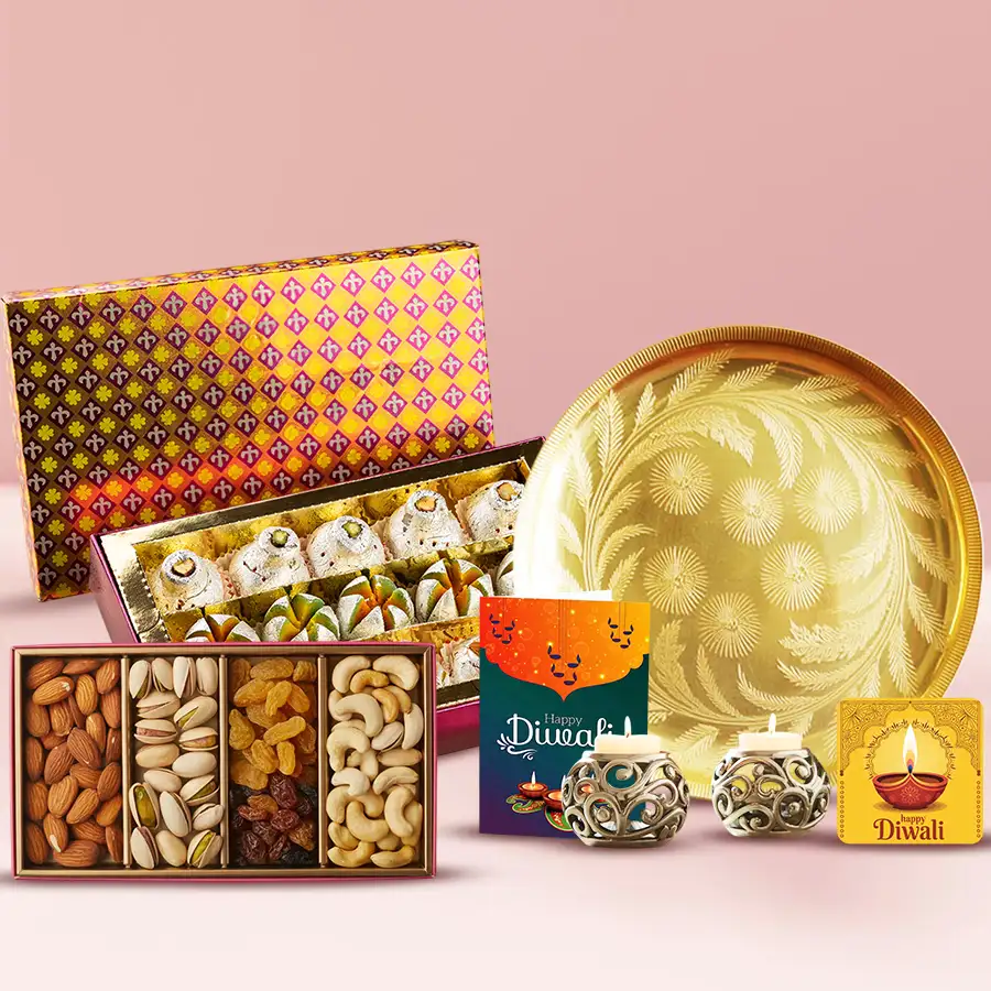 Say Sweets Festive Hamper for Diwali featuring mixed sweets, dry fruits, tea light candle holders, a handmade fridge magnet, a golden-plated thali, and a Diwali wishing card.