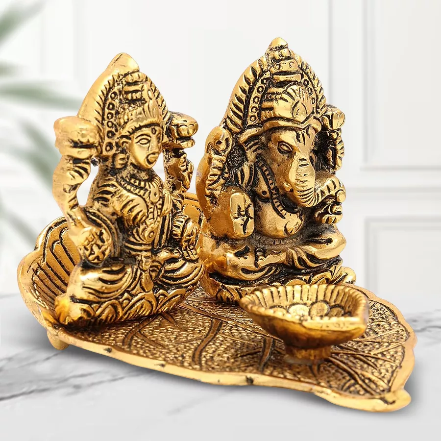 Handcrafted Antique Lakshmi Ganesh Diya in golden metal with intricate designs, measuring 4.5” x 3.5” x 3”, showcasing deities Lakshmi and Ganesh.