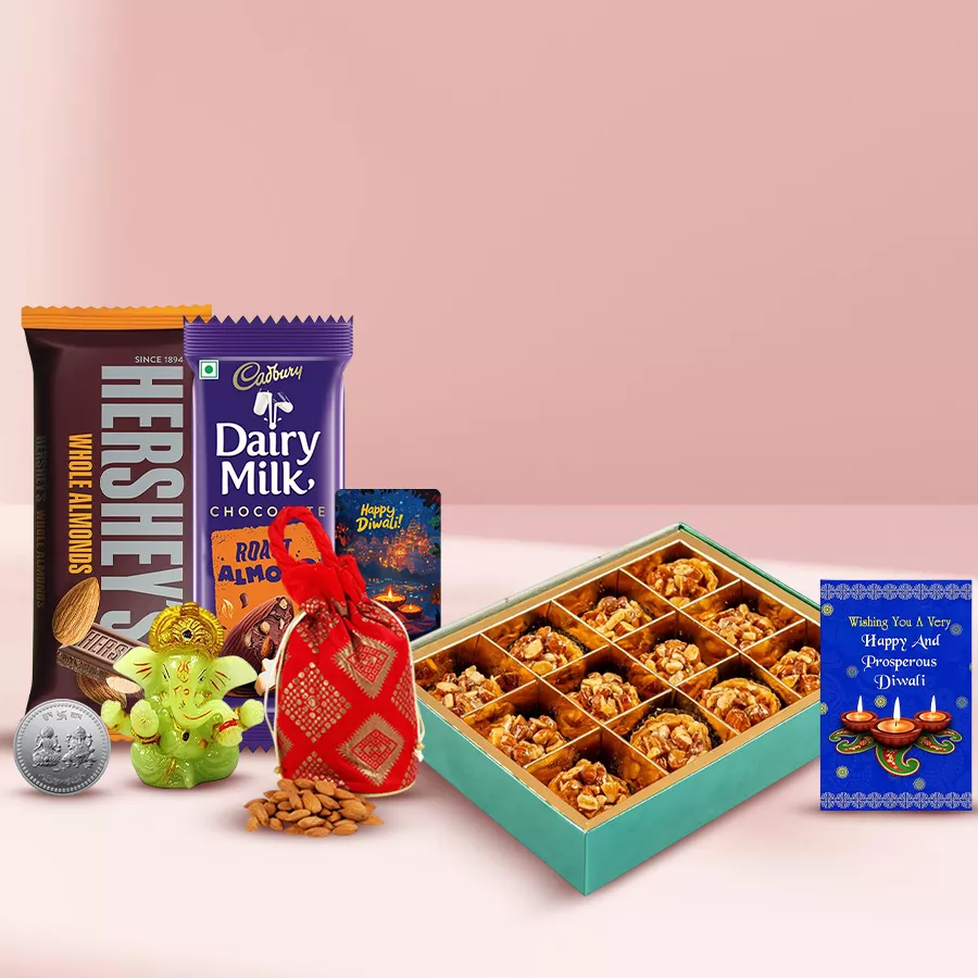Amazing Almond Tart Baklava hamper featuring almond tart baklava, chocolate bars, almond potli, Ganesh idol, Ganesh Laxmi coin, and a Diwali card.