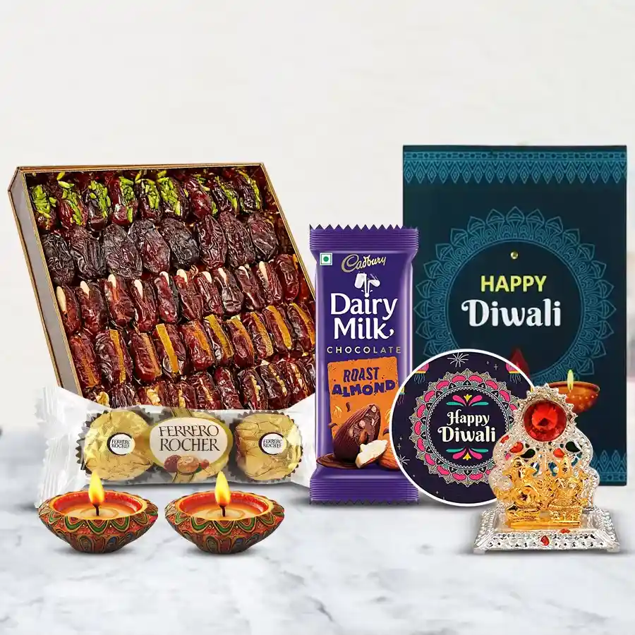 Dates Baklava Sweet Box with Chocolates, Ferrero Rocher, Cadbury Dairy Milk Roast Almond bar, diyas, Happy Diwali fridge magnet, Ganesh Laxmi Mandap, and a Diwali card