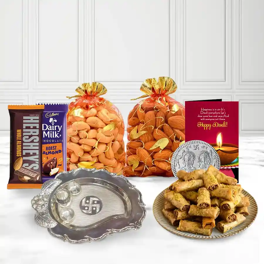 Roll Baklava Mania N Choco Feast gift box featuring baklava, chocolates, potlis, Ganesh & Laxmi coins, paan-shaped pooja thali, and a Diwali card.