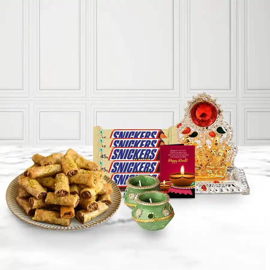 Heavenly Roll Baklava gift basket with Choco Snickers, decorated wax diyas, and Ganesh-Laxmi mandap, featuring a personalized Diwali card.