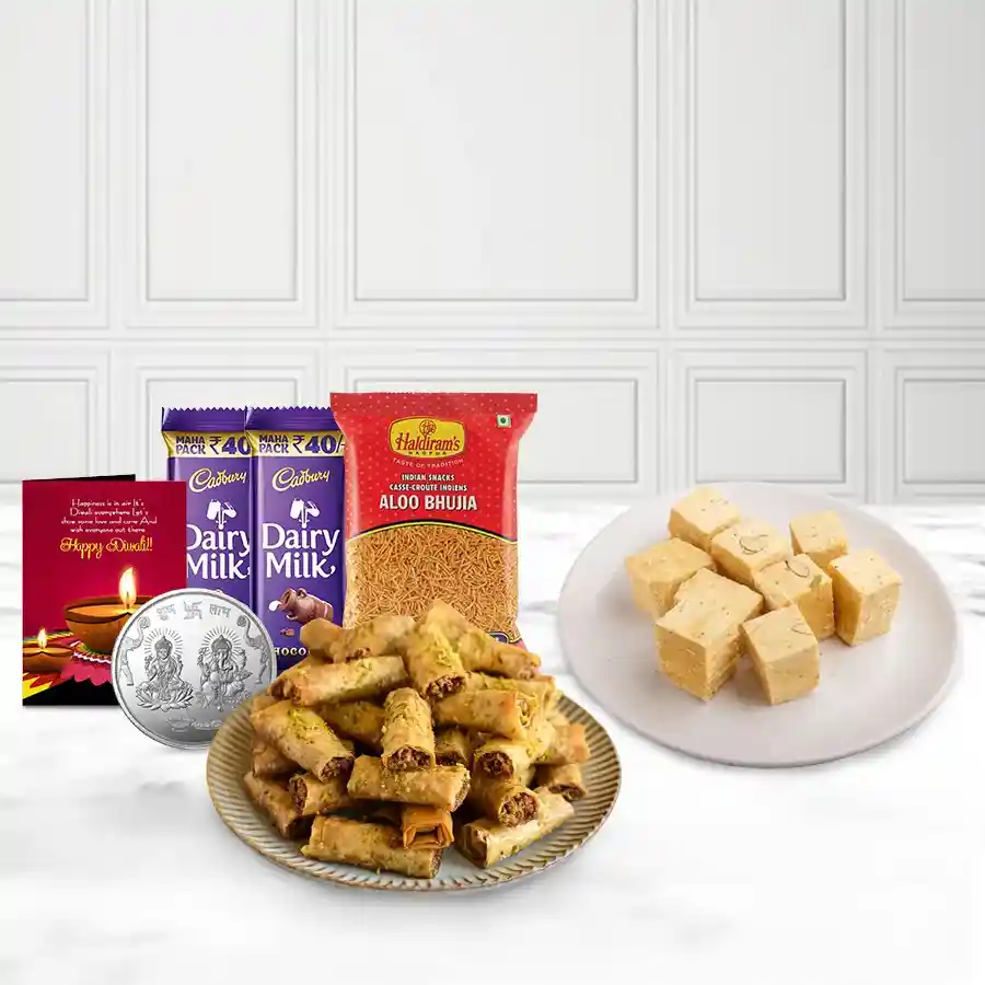 Endearing Roll Baklava Pack N Sweetness Soan Basket with Roll Baklava, Soan Papdi, Bhujiya, Cadbury Dairy Milk, Ganesh-Laxmi coin, and Diwali card