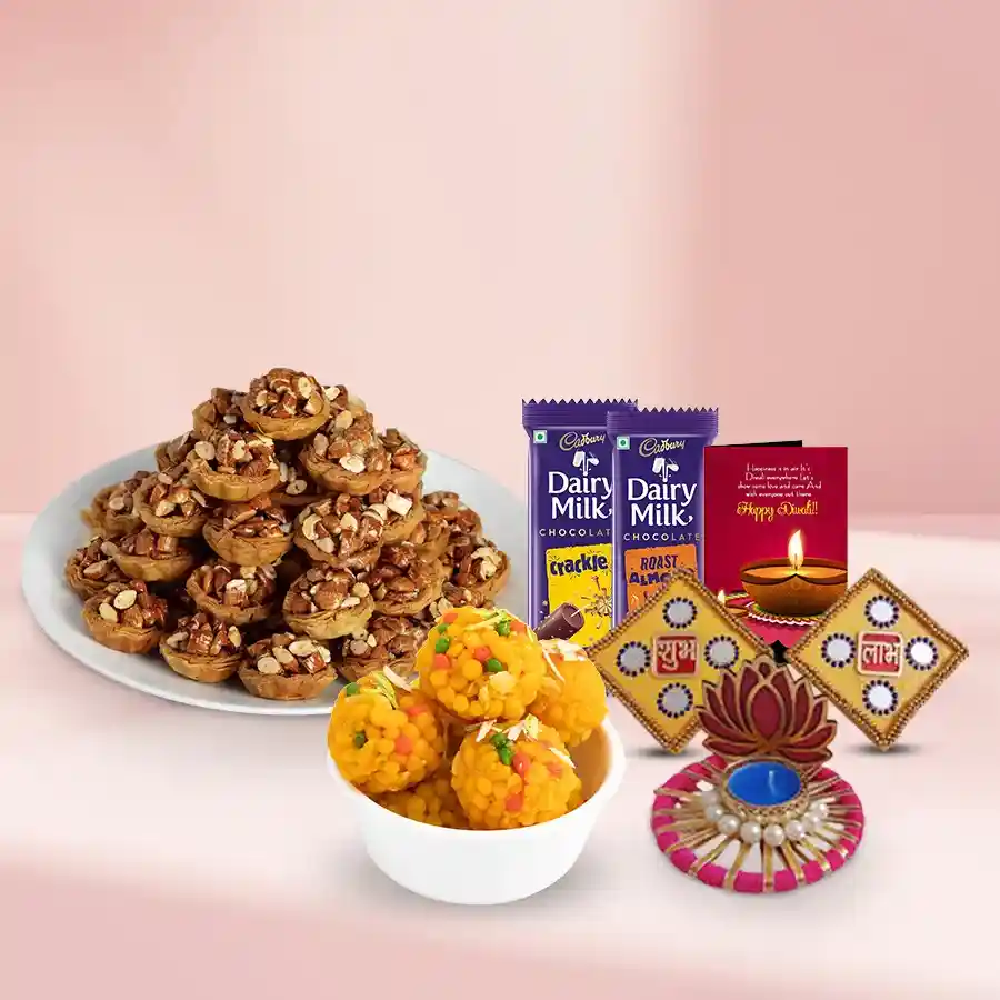 Heavenly Tart Baklava and Boondi Treat gift basket with Tart Baklava, Boondi Laddoos, Cadbury chocolate bars, Lotus tea light holder, Shubh Labh wall sticker, and Diwali card