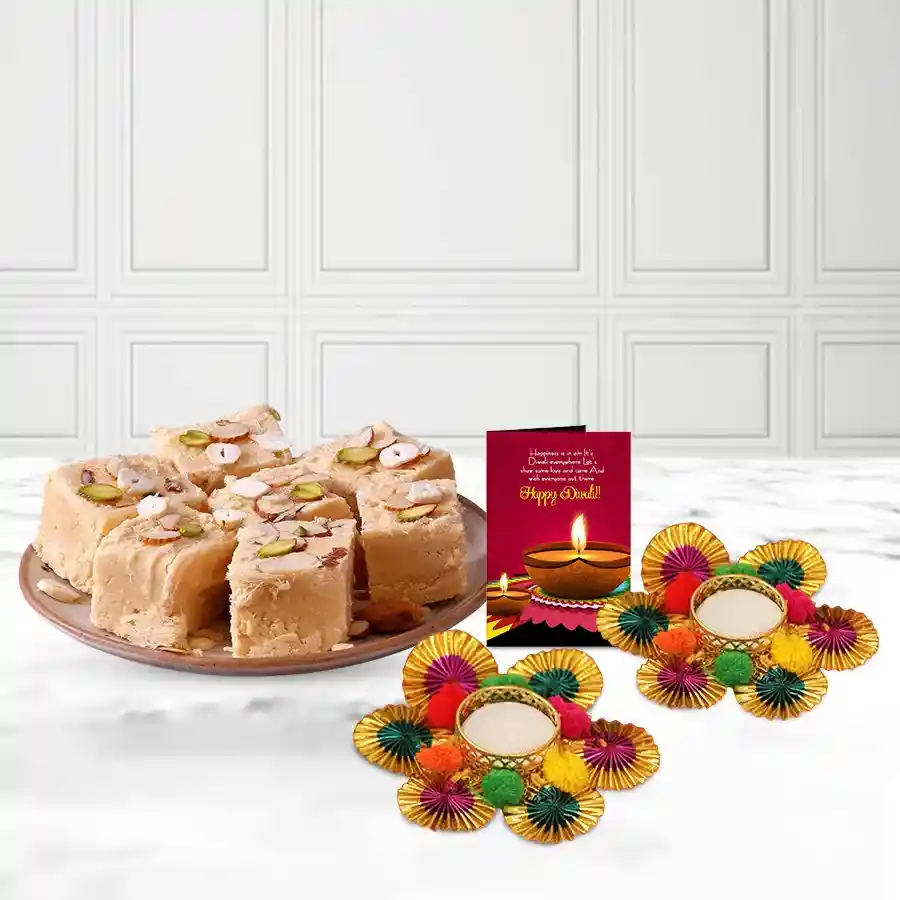 Festive hamper with two Pom-Pom Diyas, a 200g box of Soan Papdi, and a Diwali wishing card