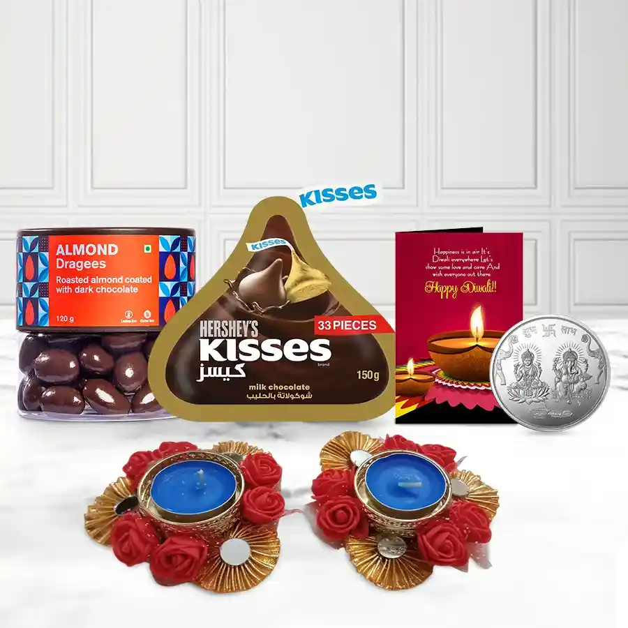 Absolute Bliss Almond Dragee and Hershey's Chocolate basket with almond dragees, Hershey's chocolates, Zardosi diyas, Ganesh-Laxmi coin, and a festive card