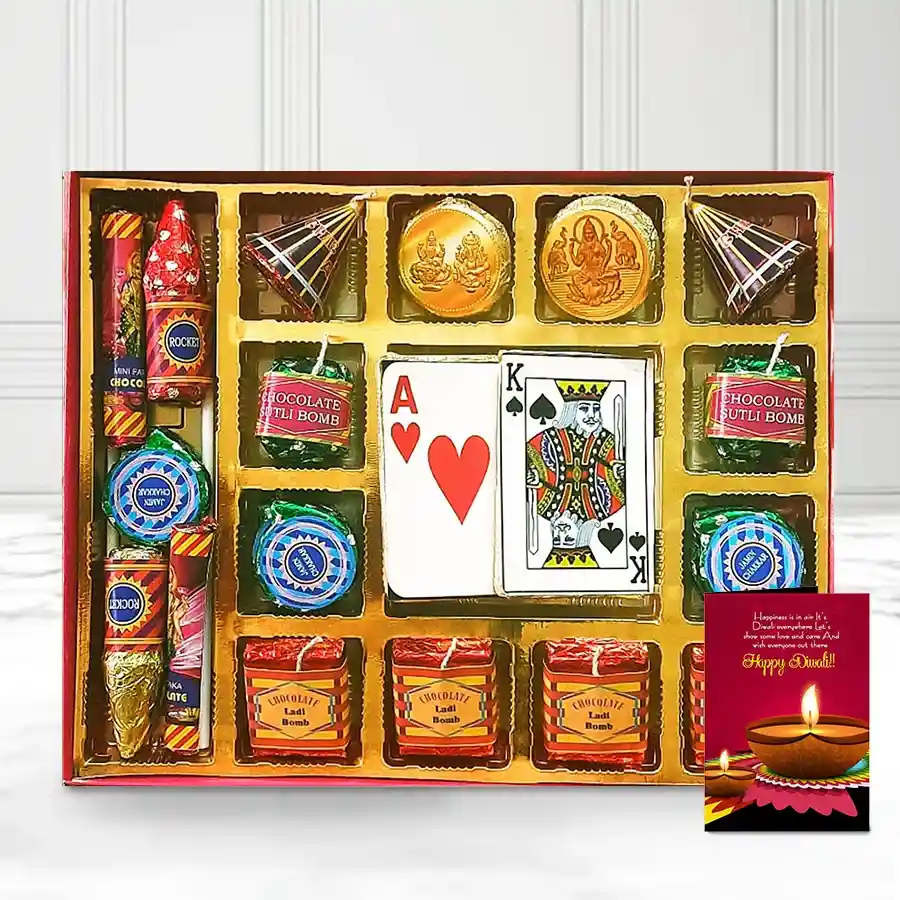 Colorful handcrafted chocolates shaped like firecrackers with a set of playing cards, ideal for Diwali celebrations.