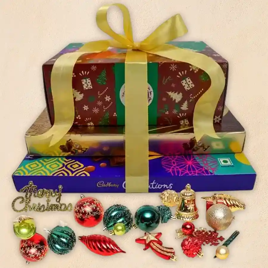 Delightful Chocolate Tower Gift featuring American Fruit Cake, Ferrero Rocher Moments, Cadbury Celebration Assorted Chocolates, and Christmas decorations