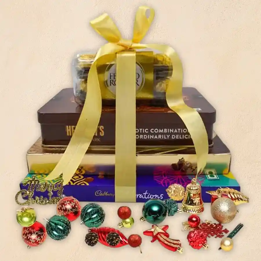 Exotic Xmas Special Chocolate Tower featuring Ferrero Rocher, Hershey's Kisses, Cadbury Celebration chocolates, and festive decorations