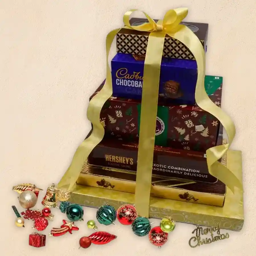 Tempting 6-layer chocolate tower with assorted chocolates and festive decorations