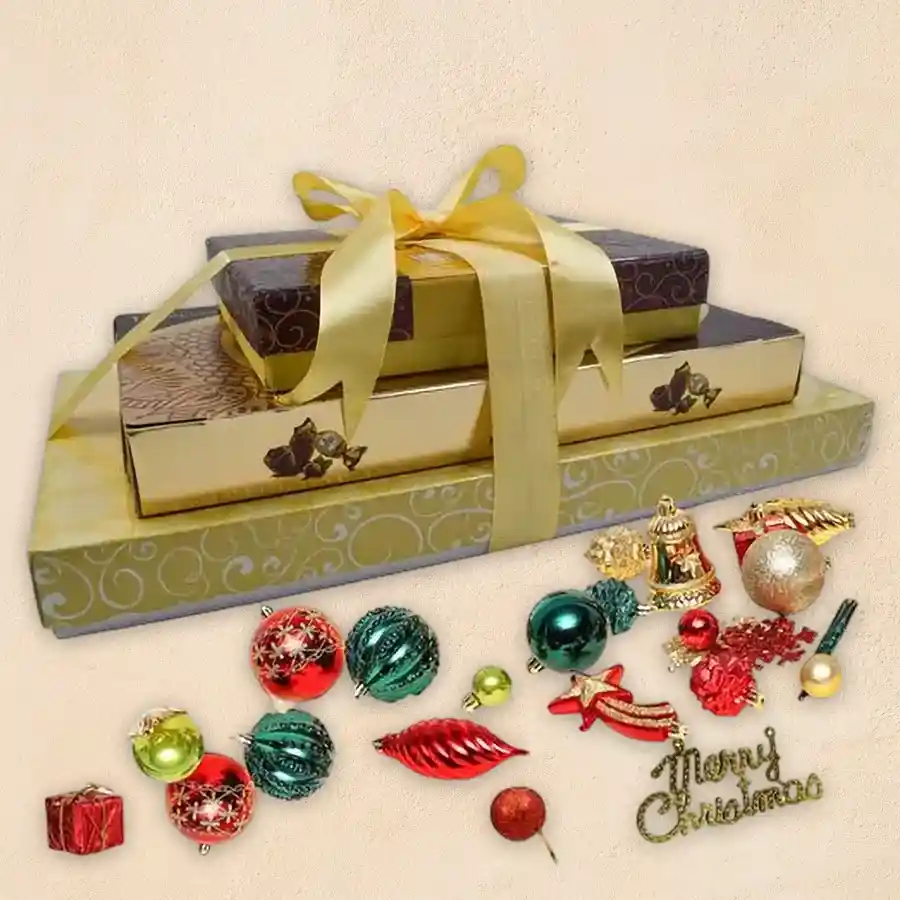 Marvelous Xmas Special Chocolate and Nut Gift Tower featuring truffle chocolates, mixed dried nuts, Ferrero Rocher Moments, and a decorative Xmas box.