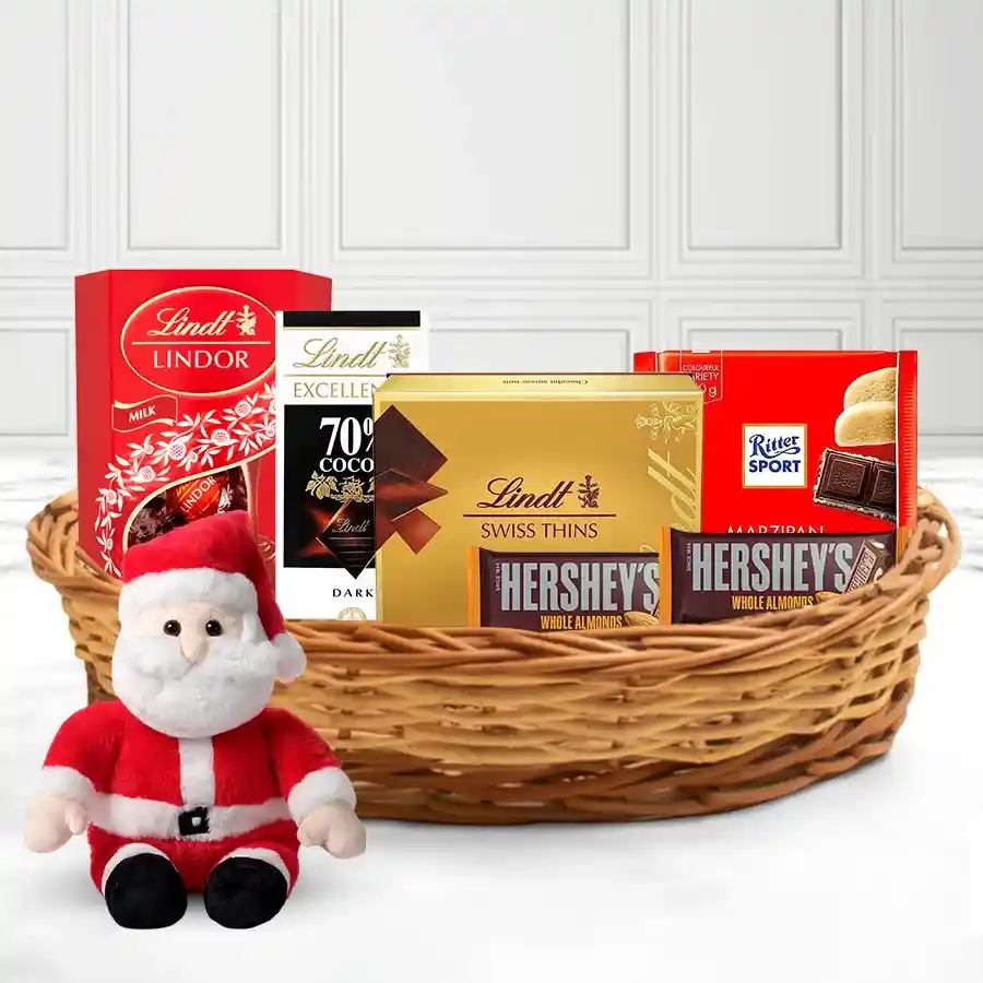 Winter Wonder X-Mas Chocolate Basket filled with assorted chocolates, Santa soft toy, and a reusable basket, festive holiday theme