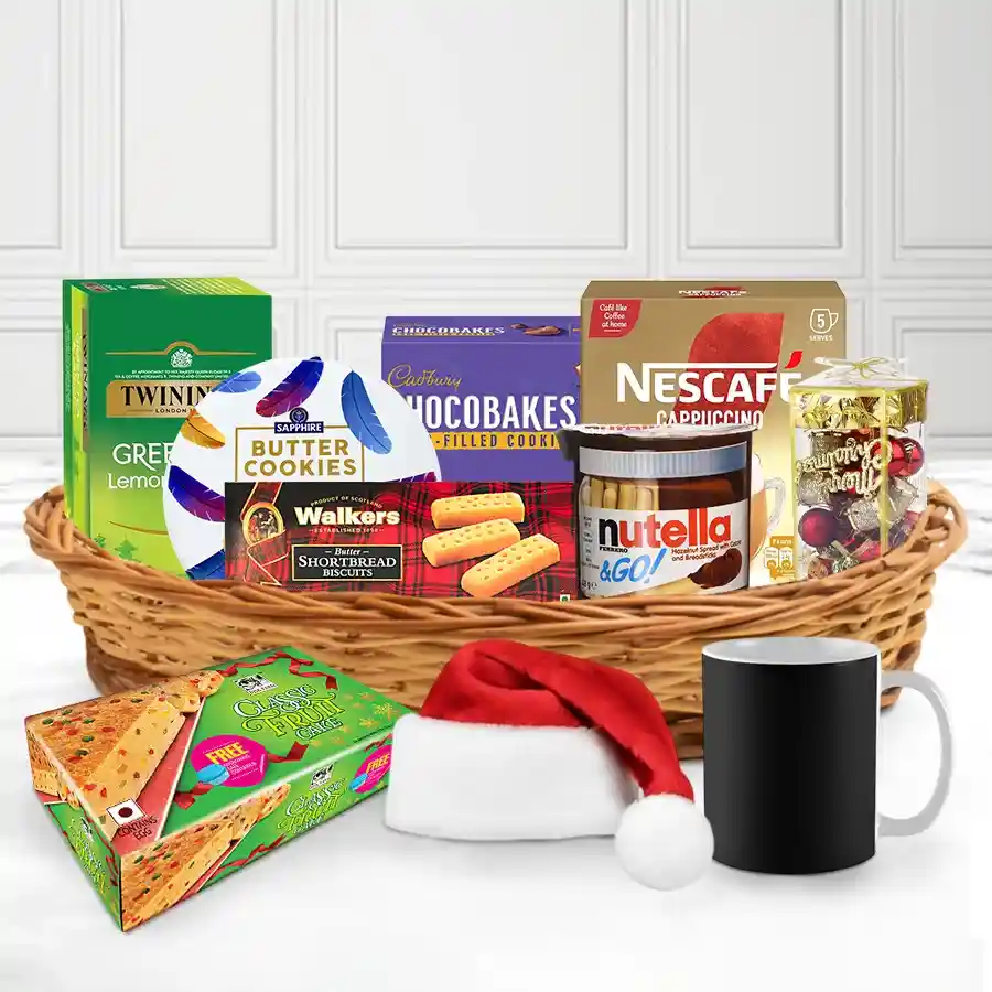Special Celebration Christmas Treat Basket filled with coffee, tea, snacks, cookies, fruit cake, and festive decorations