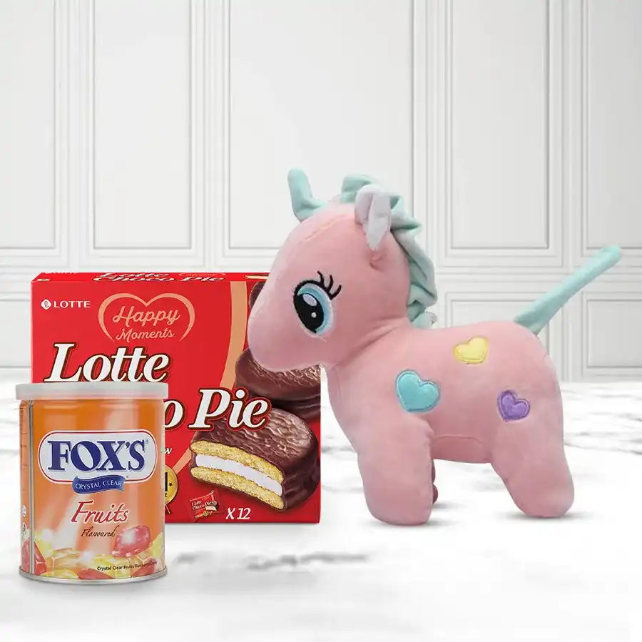 Marvelous Gift Hamper featuring a unicorn soft toy, fruit snacks, and Chocopie chocolates arranged decoratively.
