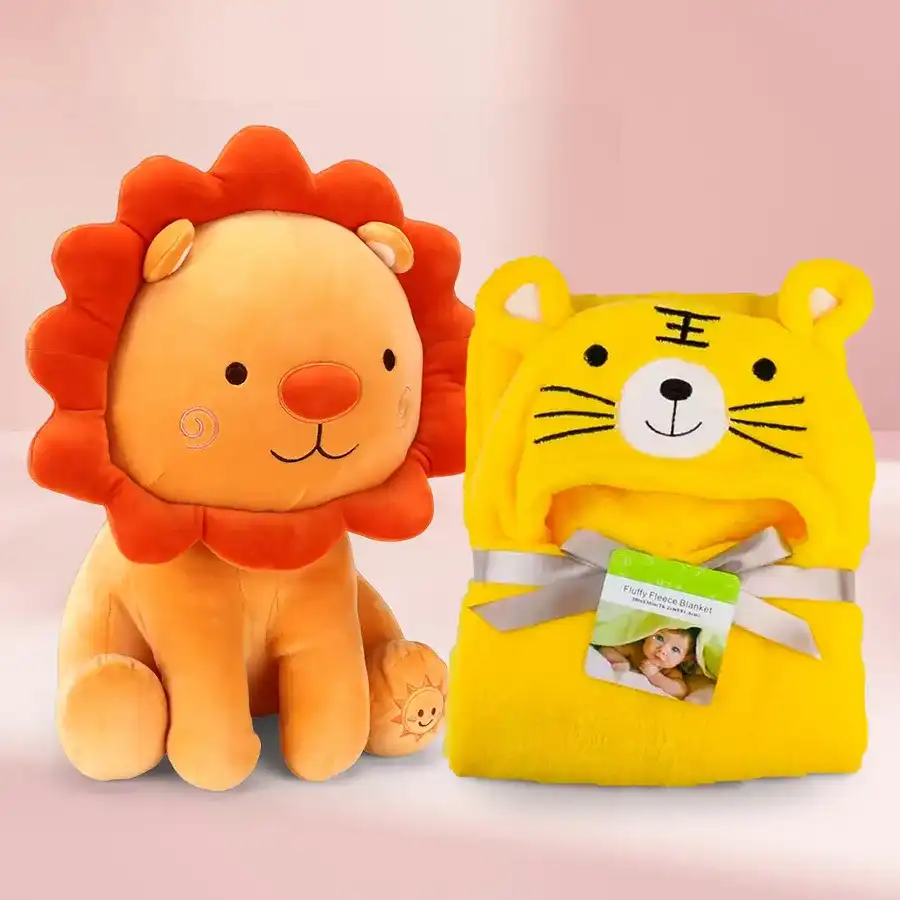 Soft toy lion and yellow hooded baby bath towel combo on a white background