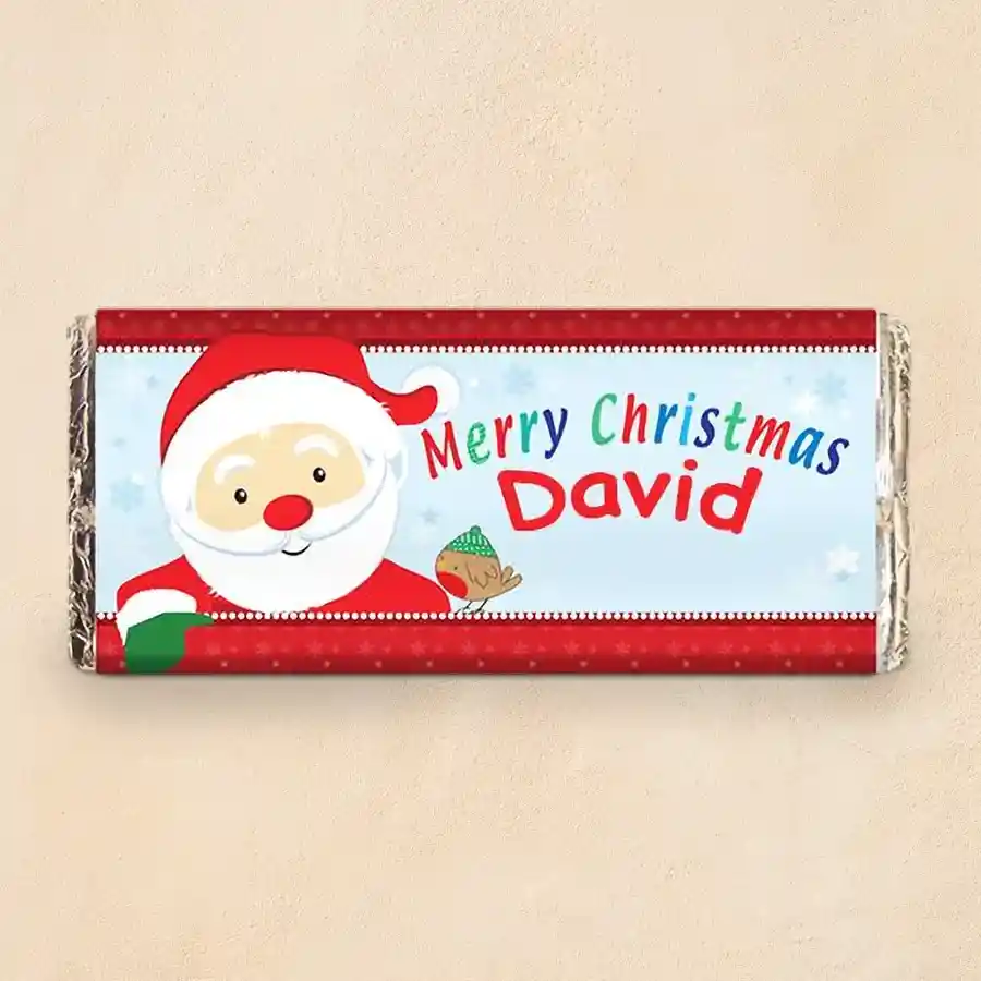 Personalized Christmas chocolate wrap featuring a Cadbury Dairy Milk bar with festive design and custom message