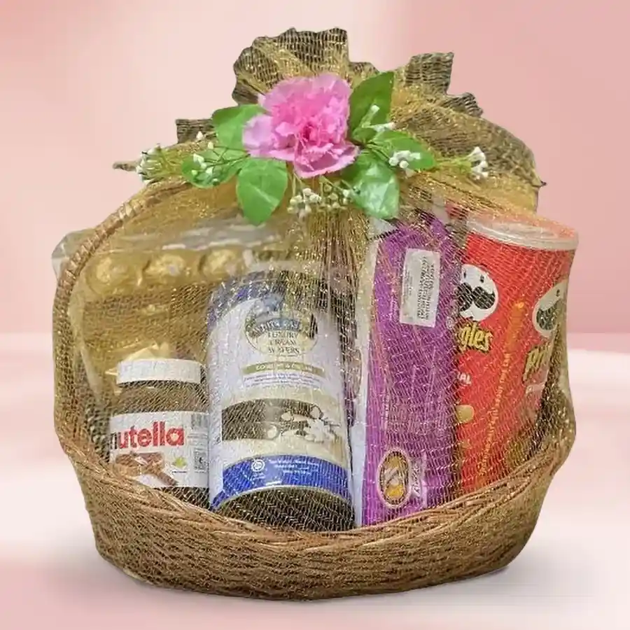 Exciting Sweet N Savory Gift Basket filled with Ferrero Rocher chocolates, Nutella Choco Spread, White Castle Rolled Wafers, Pringle Chips, and European Cookies arranged in a stylish cane basket.