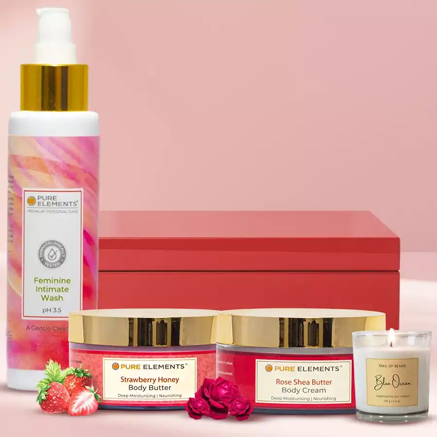 Stunning Organic Spa Treatment Gift Hamper from Pure Elements featuring body butter, body cream, intimate wash, and a scented candle in an elegant red box.