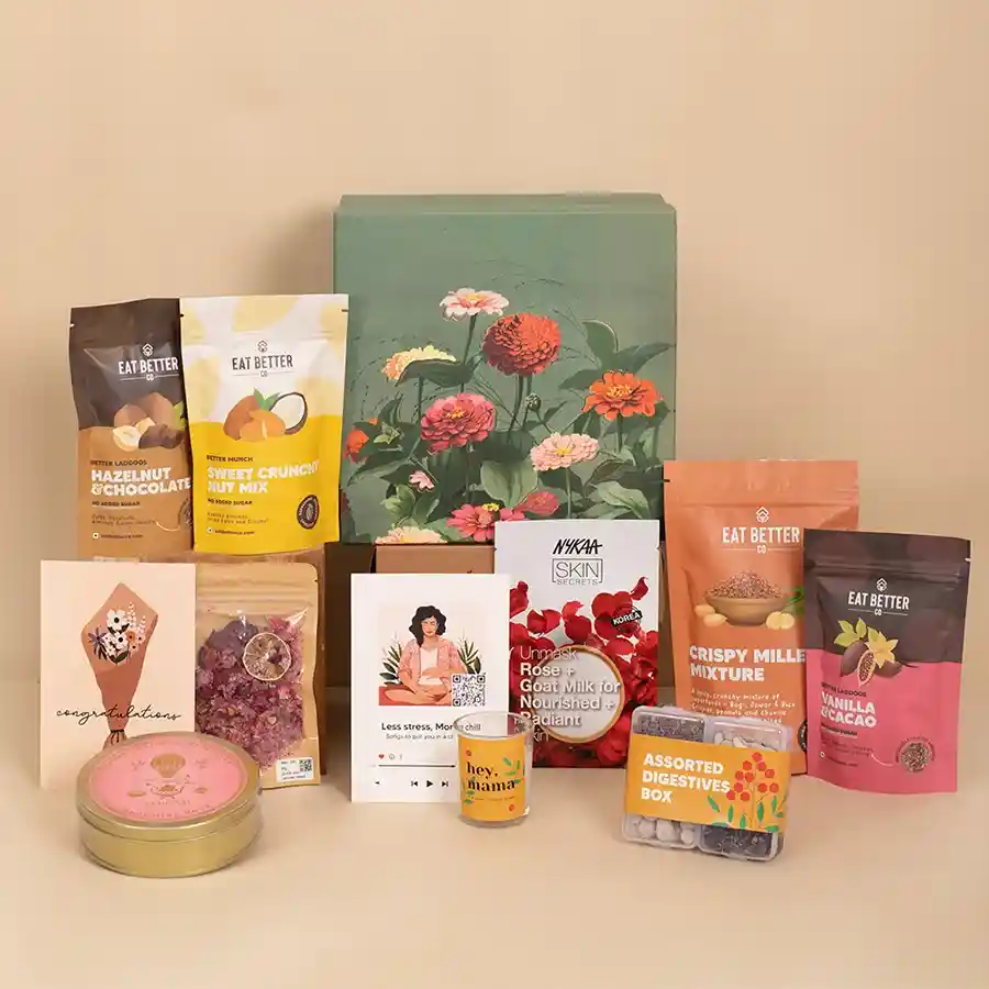 Blooming Garden Gift Box filled with healthy treats, foot salts, face mask, candle, and more for new moms.