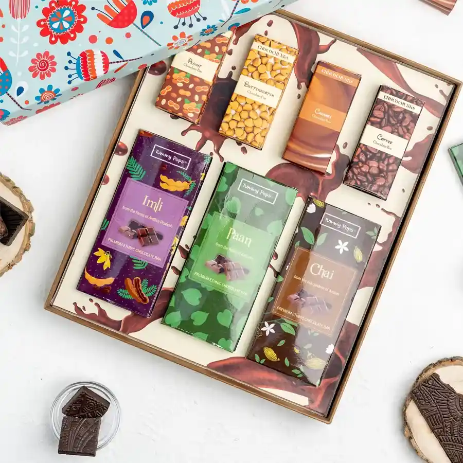 Handmade assorted chocolate treats including big bars in unique flavors and assorted favorites, beautifully packaged as a gift.
