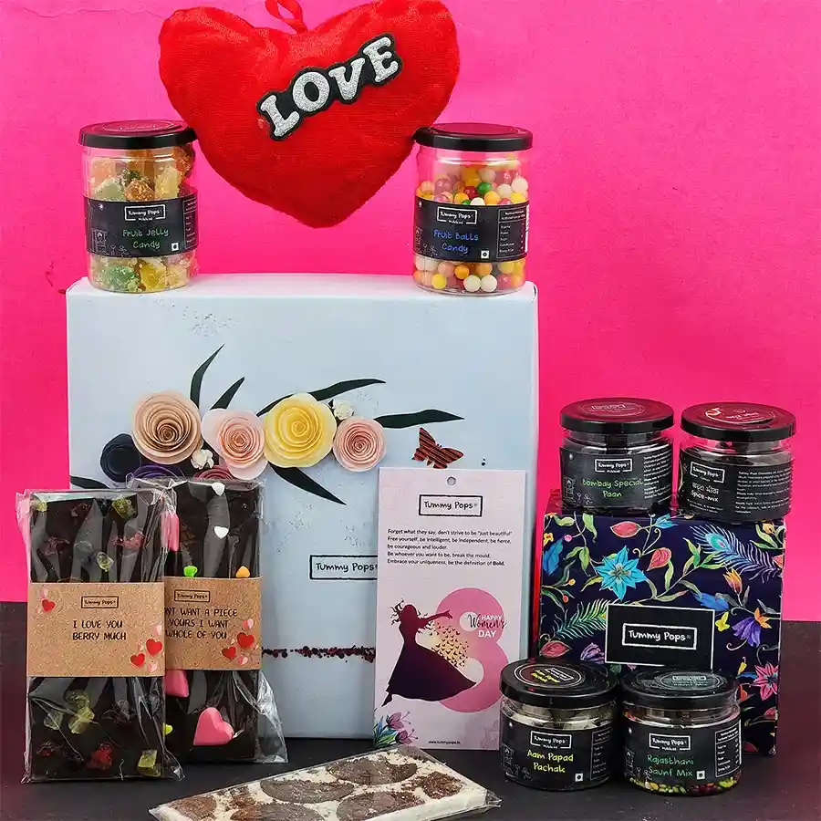 Assorted chocolates and treats gift box with heart shape cushion and diary bookmark