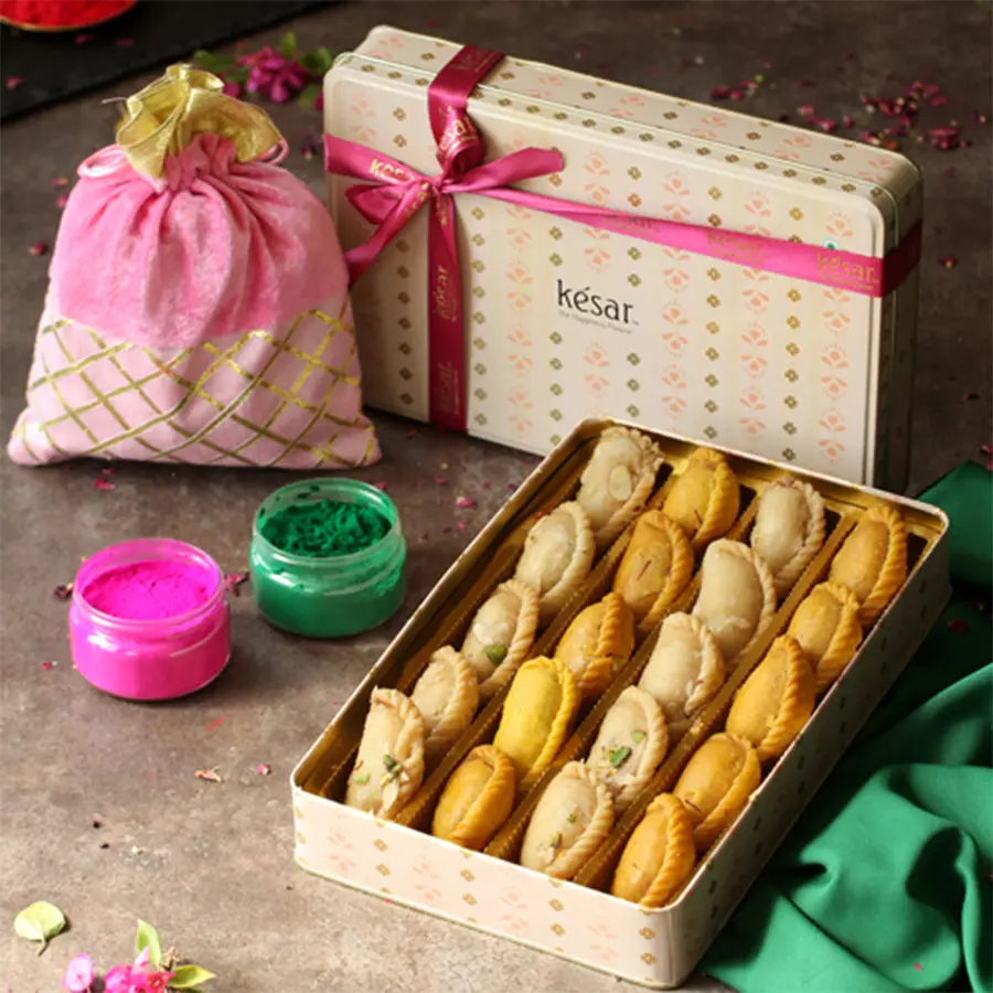 Special Gift Combo of Assorted Gujiya with Herbal Colors Potli, featuring elegant packaging, delicious Kesar and plain Gujiyas, eco-friendly colors, and a Holi greeting card.
