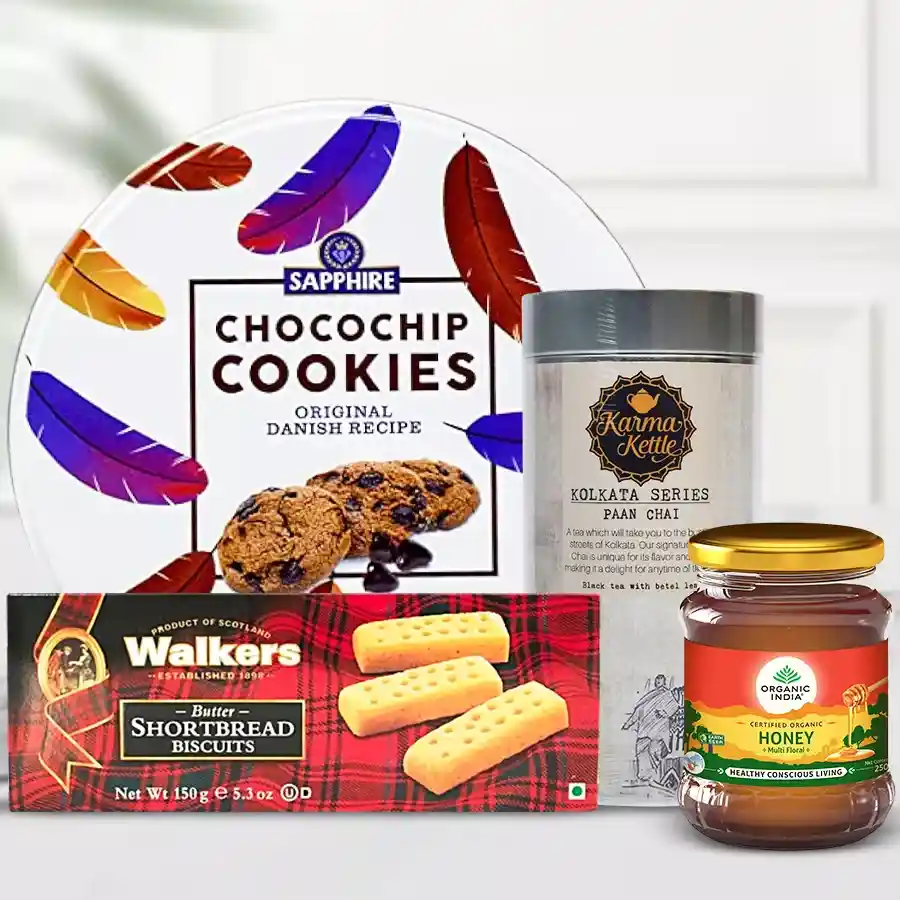 Flavored Paan Cha and Snacks Delight Hamper featuring Karma Kettle Paan Cha, Sapphire Chocochip Cookies, Walkers Short Bread Biscuits, and Indian Organic Honey