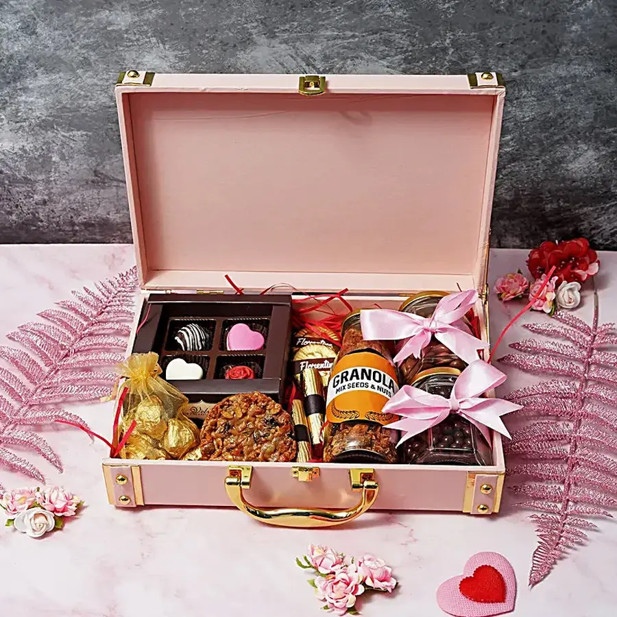 Chocolaty Bliss with Cookies N Assortment Mother's Day Hamper filled with assorted chocolates, almond florentines, crunchy granola, chocolate-coated butterscotch and raisins, almond chocolate rocks, mixed nut florentine cookies, and chocolate logs.