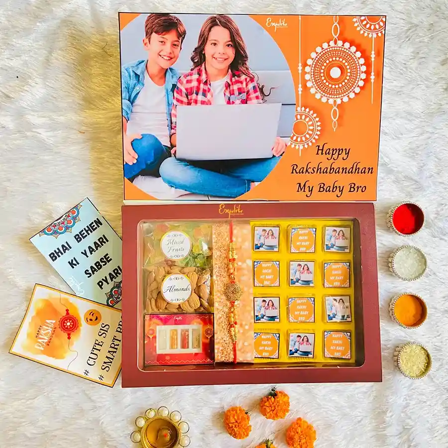 Classic Rakhi with Customized Chocolates Hamper featuring a designer metal mauli rakhi, assorted chocolates, crunchy almonds, dried mixed fruits, and a greeting card.