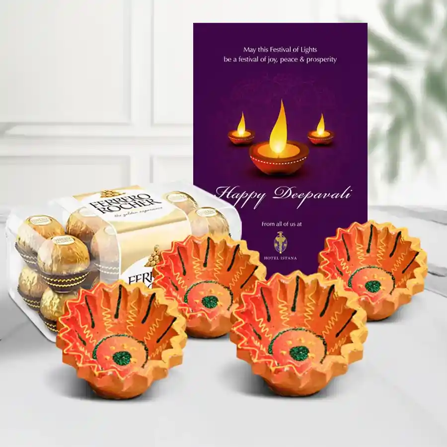 Diwali Diya and Chocolate Luster Hamper featuring Ferrero Rocher chocolates, handmade clay diyas, and a Happy Diwali greetings card