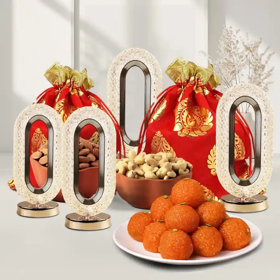 Diwali Chocolates n Crunches Bliss Box featuring crunchy cashews, tasty almonds, motichoor ladoos, and crystal LED lights in elegant potlis.
