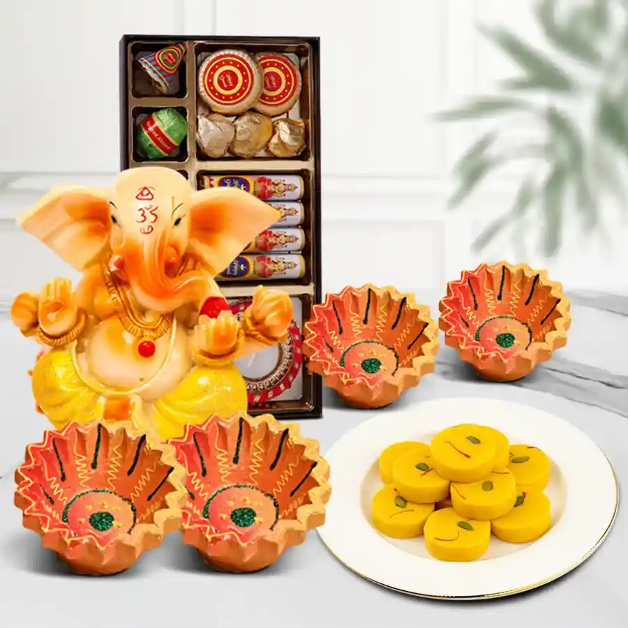 Diwali Radiance Extravaganza Hamper featuring a Vignesh Ganesh idol, 200g Kesariya Peda, assorted crackle-shaped chocolates, and four designer clay diyas.
