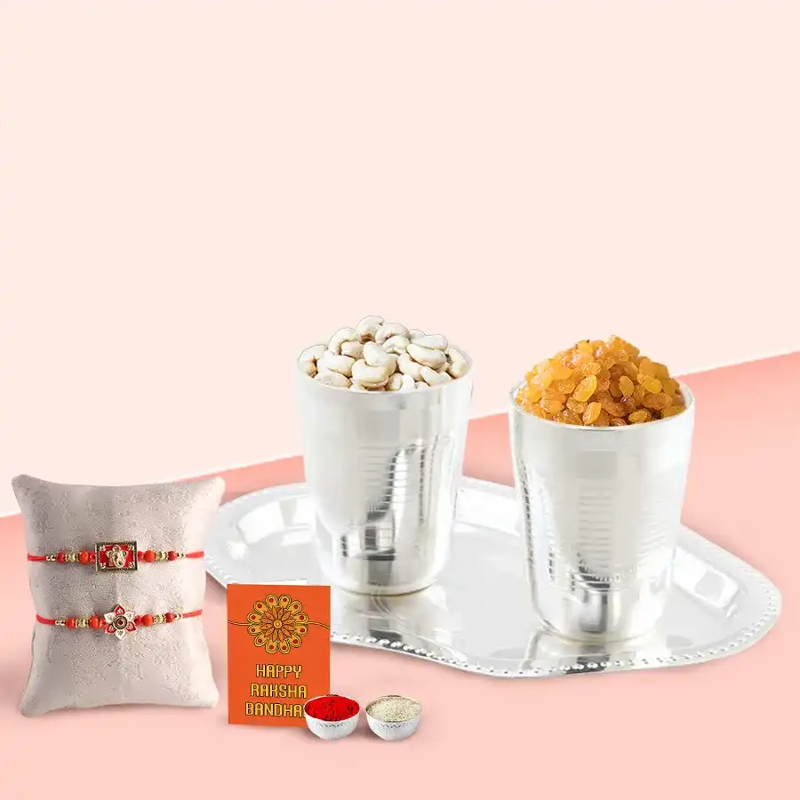 Special dry fruit hamper in silver-plated glasses and tray with Rakhis, Roli, tilak, and chawal