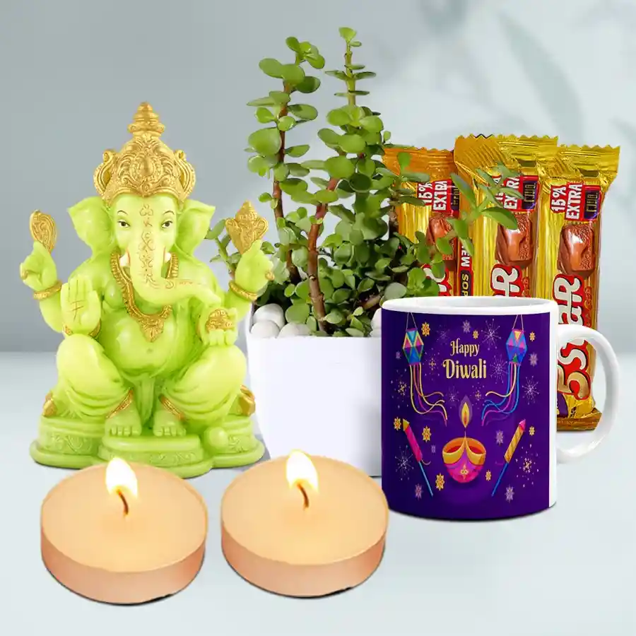 Illuminated Diwali Indulgence Box featuring a glowing Pagdi Ganesh idol, a jade plant, a Happy Diwali ceramic mug, Cadbury 5 STAR chocolates, and scented T-light candles.