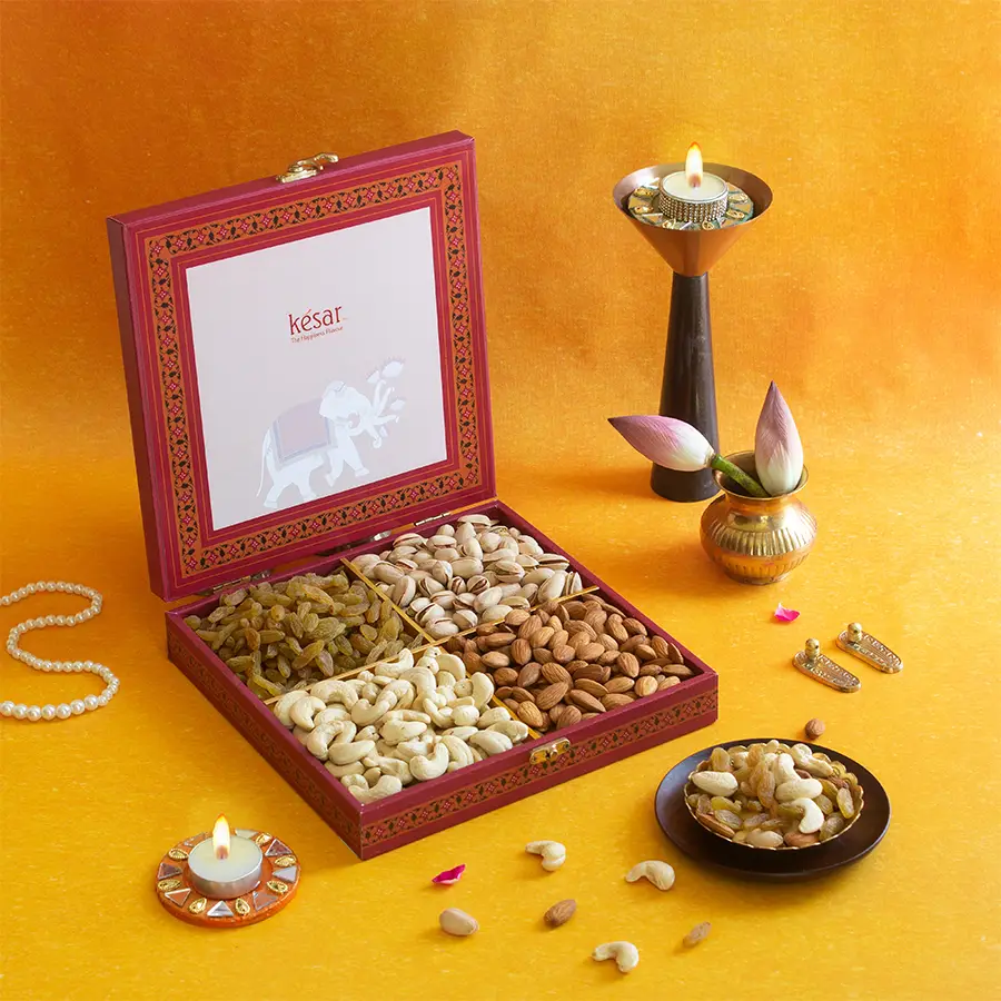 Royal Nut Medley Delight Box featuring creamy cashews, crunchy almonds, flavorful pistachios, and sweet raisins in an elegant packaging for Diwali celebrations.
