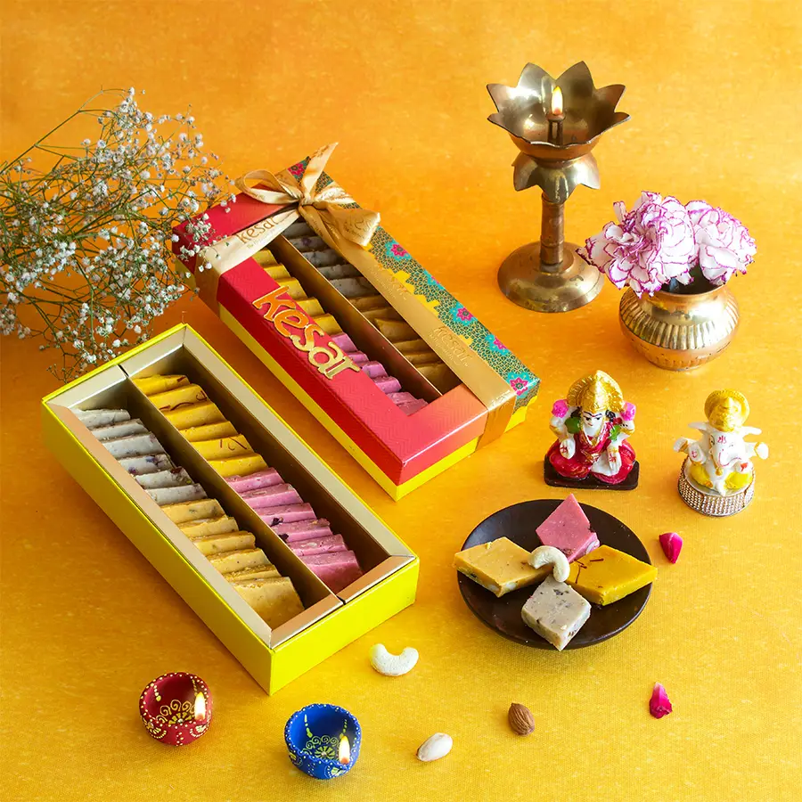 Flavourful Katli Diwali Gift Box with Katli sweets, Ganesh Laxmi idol, decorative diyas, and a Diwali greetings card