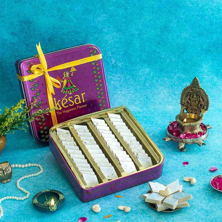 Gorgeous pink tin filled with 600g of Kaju Katli, showcasing its elegant packaging for Diwali celebrations.