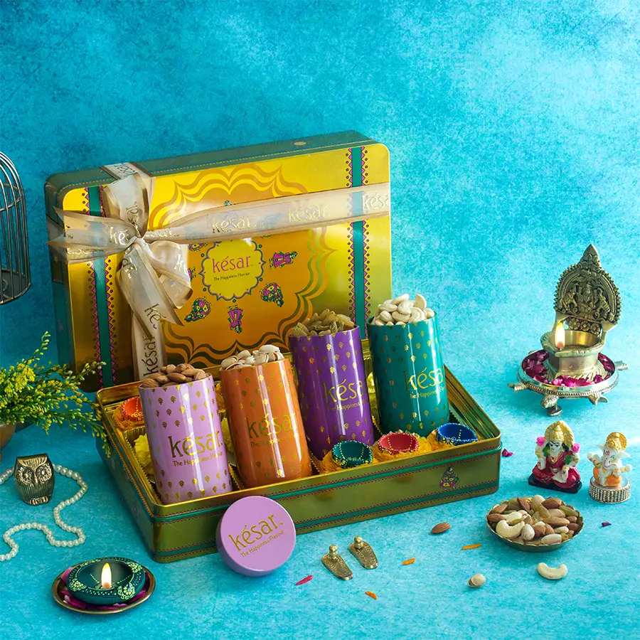 Mega Nuts Box and Diya Set featuring assorted nuts in elegant tin cans and six vibrant diyas in a Kesar Yellow special tin box