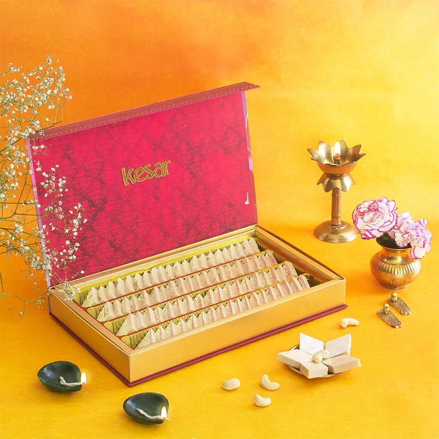 Luxury Kaju Katli gift box with pink floral design containing 1kg of premium Kaju Katli