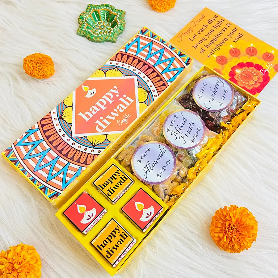Exquisite Diwali Gourmet Surprise Box with four chocolate flavors, crunchy almonds, mixed fruits, and a greeting card, featuring vibrant Diwali-themed prints