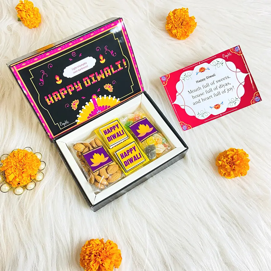 Charming Diwali Chocolate and Healthy Snacks Duo gift box featuring assorted chocolates, mixed fruits, and almonds with festive decorations.