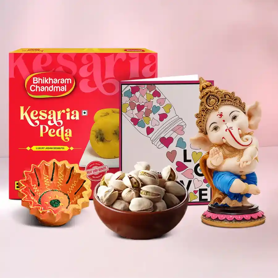 Diya, Peda, Ganesha Gift Set featuring a crafted diya, Kesaria Peda, pistachios, and a Lord Ganesha showpiece