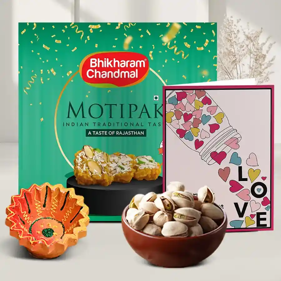 Pistachios and diya gift hamper featuring a diya, 500g of Motipak sweets, and 100g of pistachios