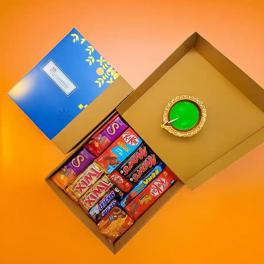 Diwali Joy Chocolate Bonanza hamper featuring a variety of chocolates and a traditional Diya