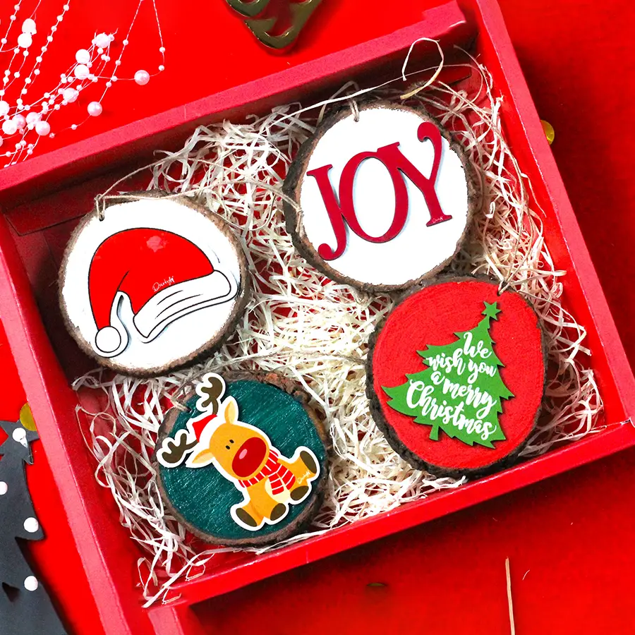 Quirky Sliced Logs Gift Set featuring four unique hand-crafted wooden logs arranged together