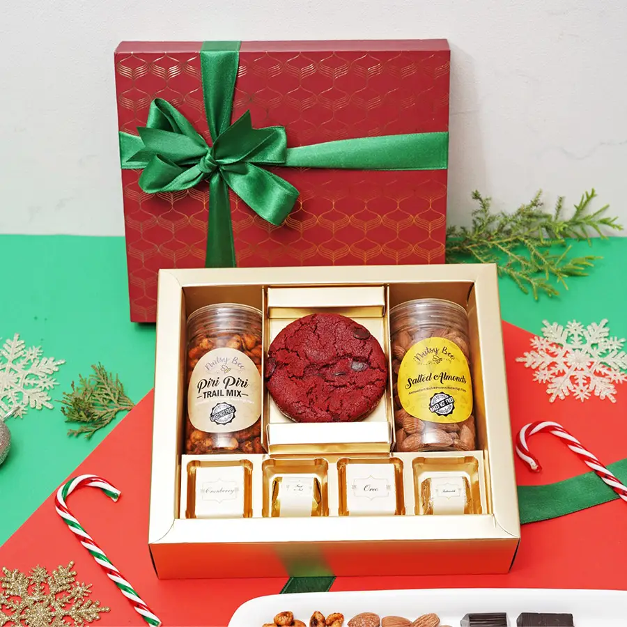 Taste of the Season Gift Box filled with Piri Piri Trail Mix, Salted Almonds, assorted chocolates, and a red velvet cookie