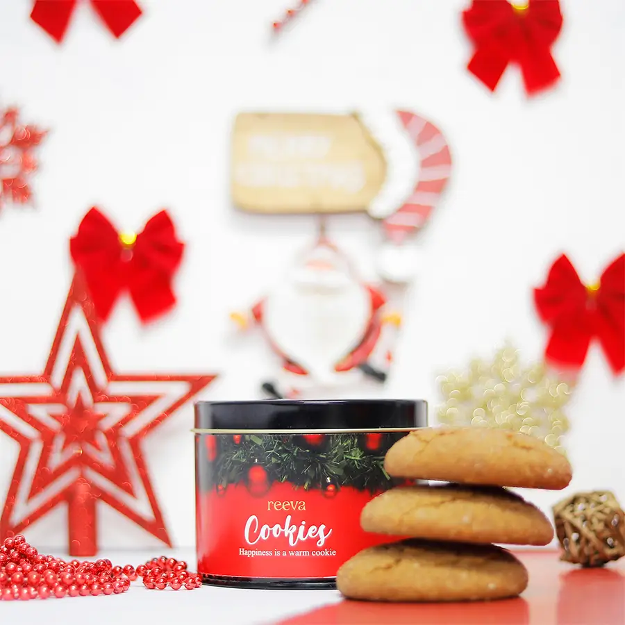 A festive assortment of Christmas Snickerdoodle cookies arranged on a decorative plate, showcasing their soft, chewy centers and crispy edges, sprinkled with cinnamon sugar.