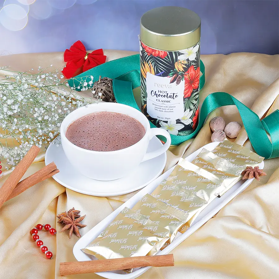 Indulge and Enjoy Hot Chocolate Powder gift box with cocoa and a steaming mug of hot chocolate